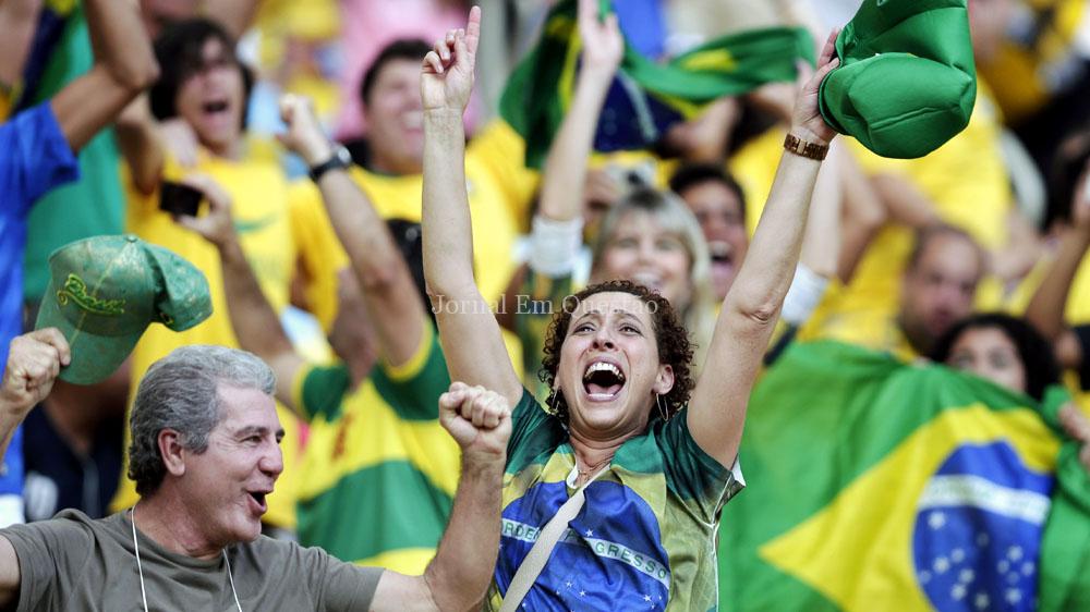 Brazilian supporters cheer while watching a penalty shootout after regulation time between Brazil and Chile before the World Cup round of 16 soccer match between Colombia and Uruguay at the Maracana Stadium in Rio de Janeiro, Brazil, Saturday, June 28, 2014. (AP Photo/Marcio Jose Sanchez)